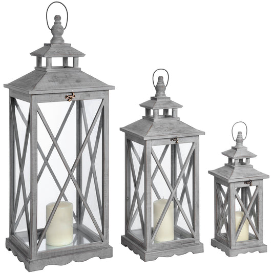 Set of three distressed wooden lanterns with traditional cross section design