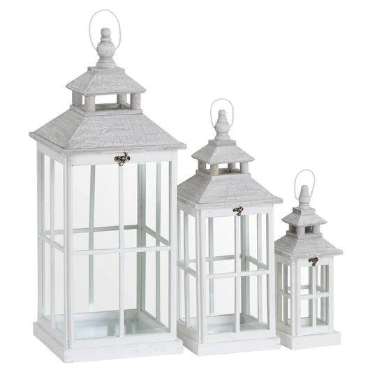Set of three white window style lanterns with open tops in wood and glass