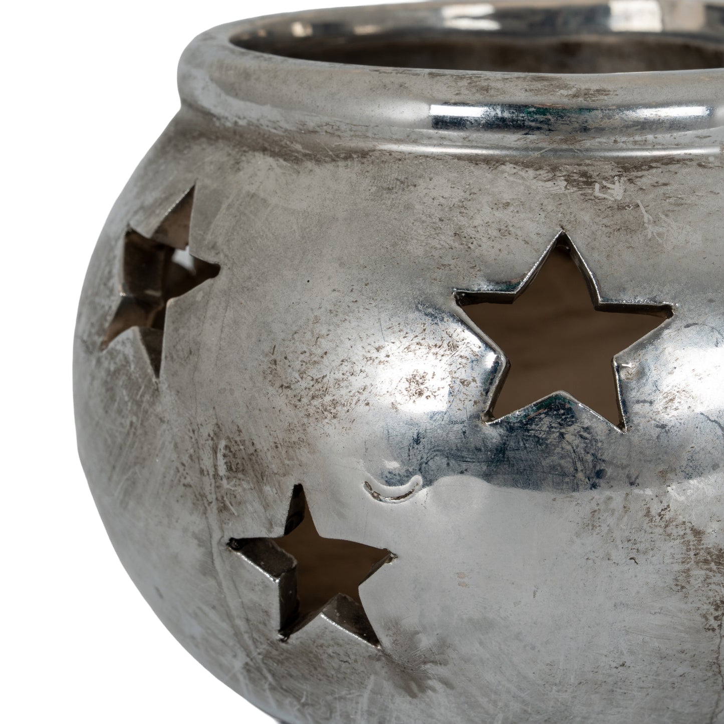 Aspen star tea light lantern shown lit on a table
