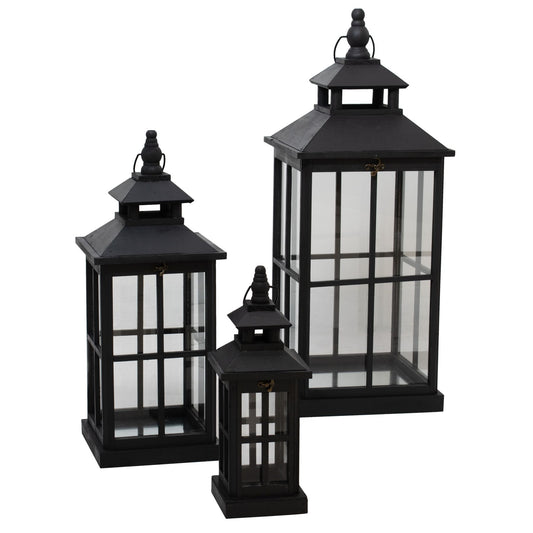 Set of three black window style lanterns with open tops in wood and glass
