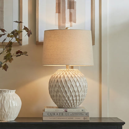 Lattice ceramic table lamp in cream with pierced openwork base and linen shade