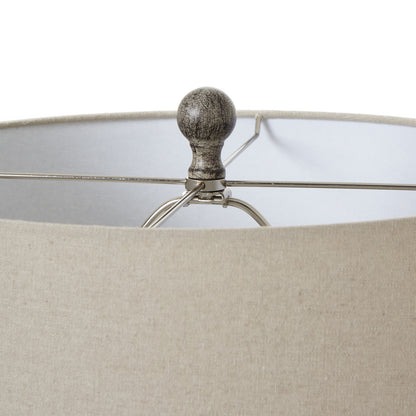 Ochre carved table lamp styled in a warm neutral room