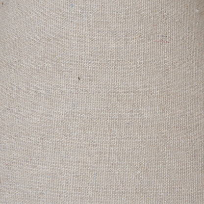 Setia column table lamp shown on a shelf