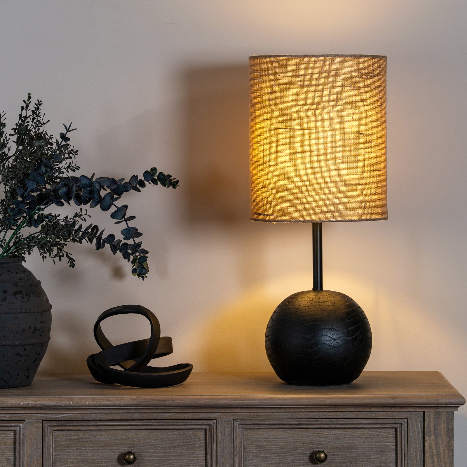 Black cannon table lamp in matte black metal with hessian shade