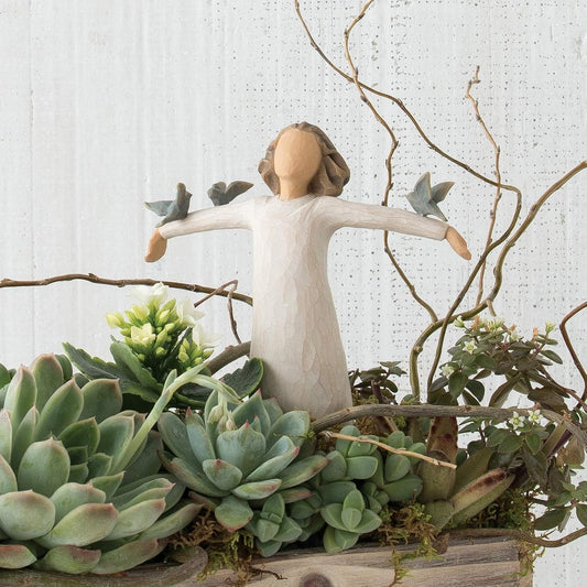 Willow Tree Happiness figurine styled among succulents