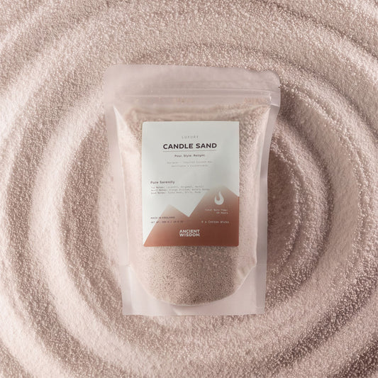 Pure Serenity fragranced candle sand in latte beige, 300g, in a resealable pouch on swirled sand