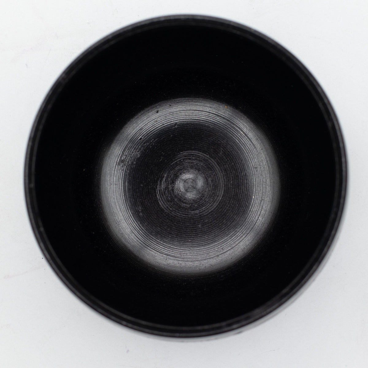 Top view into the smooth black interior of the blue Magic Mushroom bowl