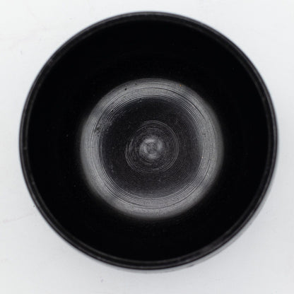 Top view into the smooth black interior of the blue Magic Mushroom bowl