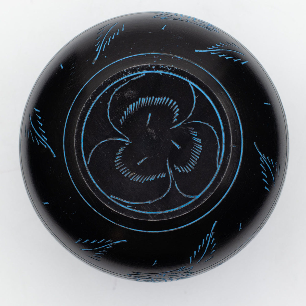Underside of the blue Magic Mushroom bowl showing the engraved swirl motif