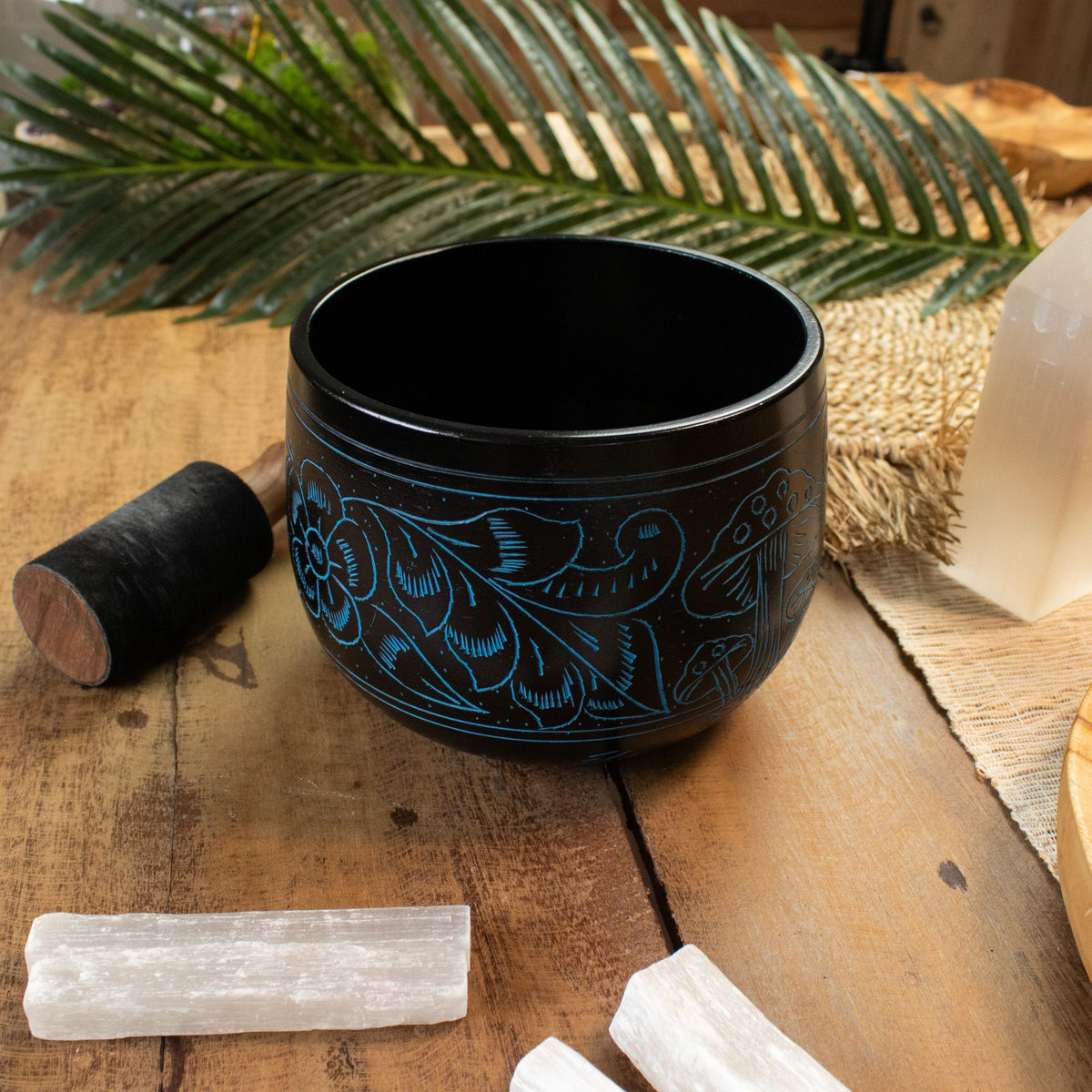 Blue Magic Mushroom bowl styled on a wooden table with selenite sticks and mallet