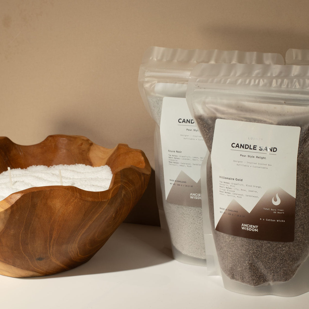 Spirited candle sand: resealable pouches styled beside a carved wooden bowl