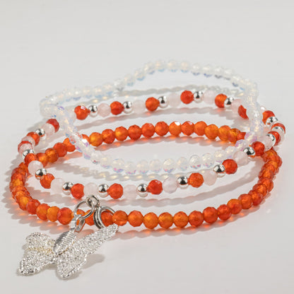 Blood Moon bracelet set laid flat, all three stacked bracelets with the butterfly charm