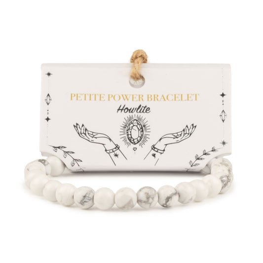 Howlite petite power bracelet with 6mm beads on its illustrated presentation card