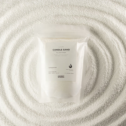 Unfragranced candle sand in white, 300g, in a resealable pouch on swirled sand