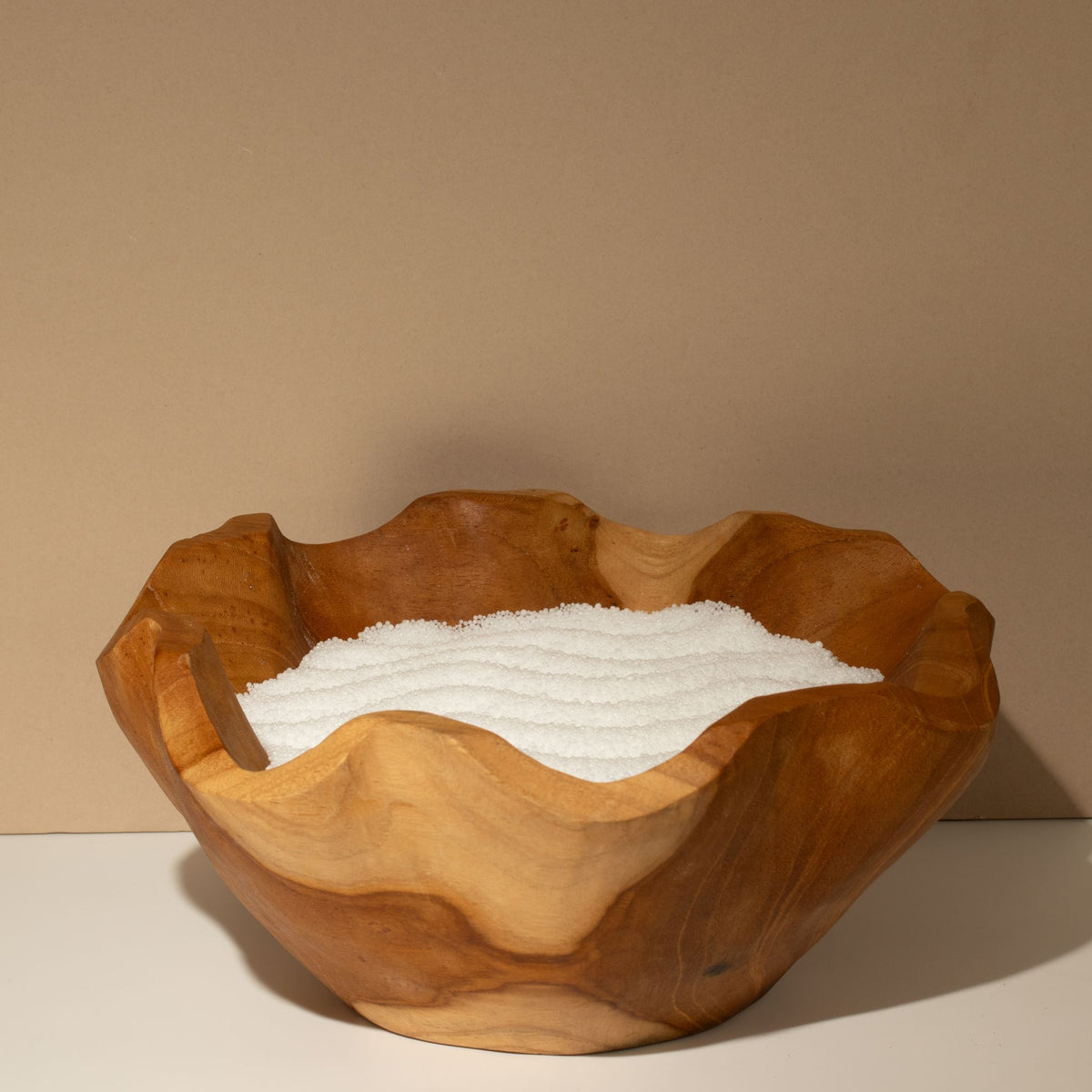 Unfragranced candle sand: smoothed in a carved wooden bowl before lighting