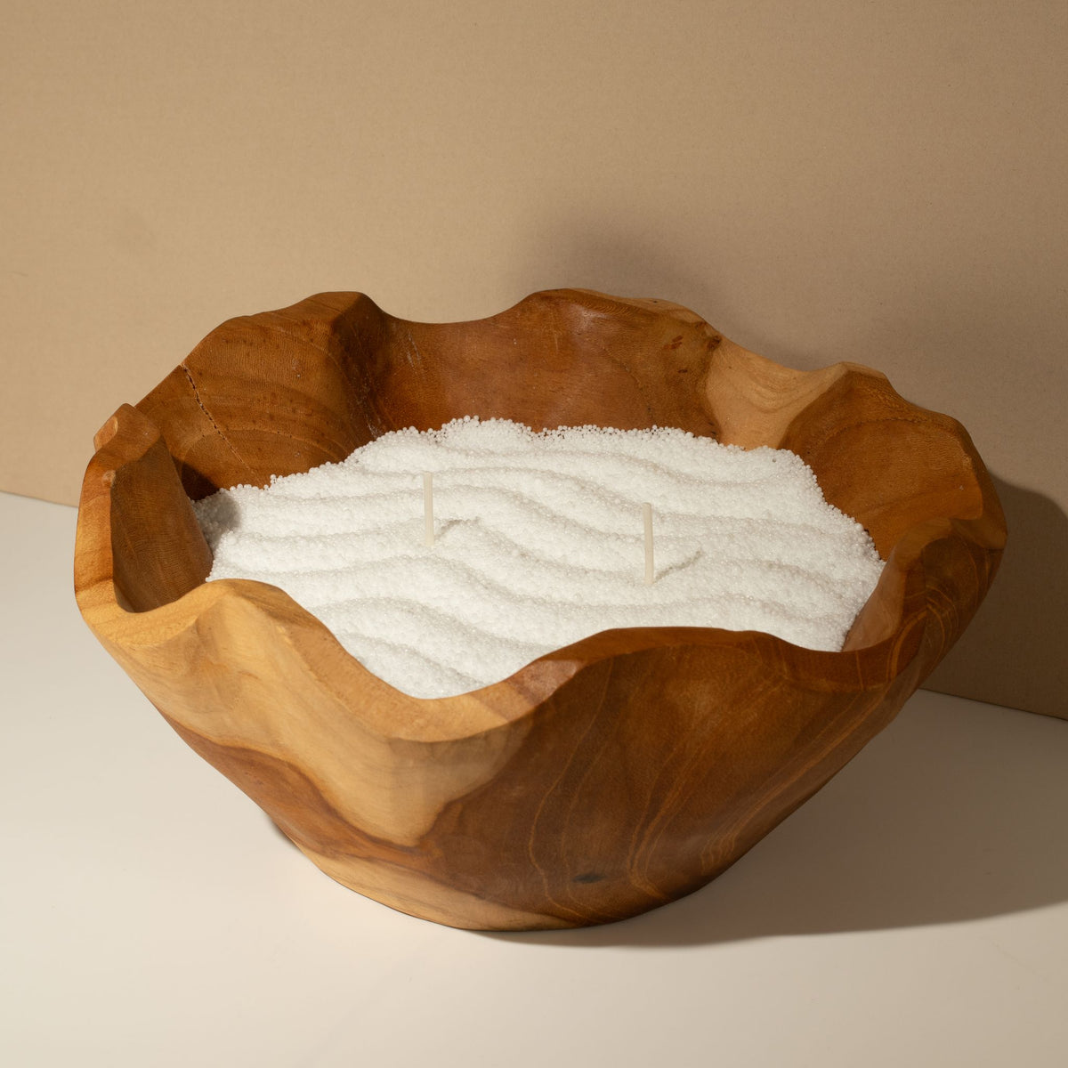Unfragranced candle sand: poured into a carved wooden bowl, ready for wicks
